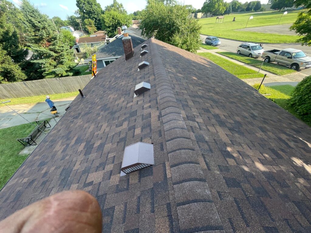 Finished roof ridge with new vents and shingles