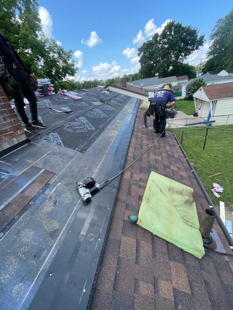 An in progress roof replacement with new underlayment