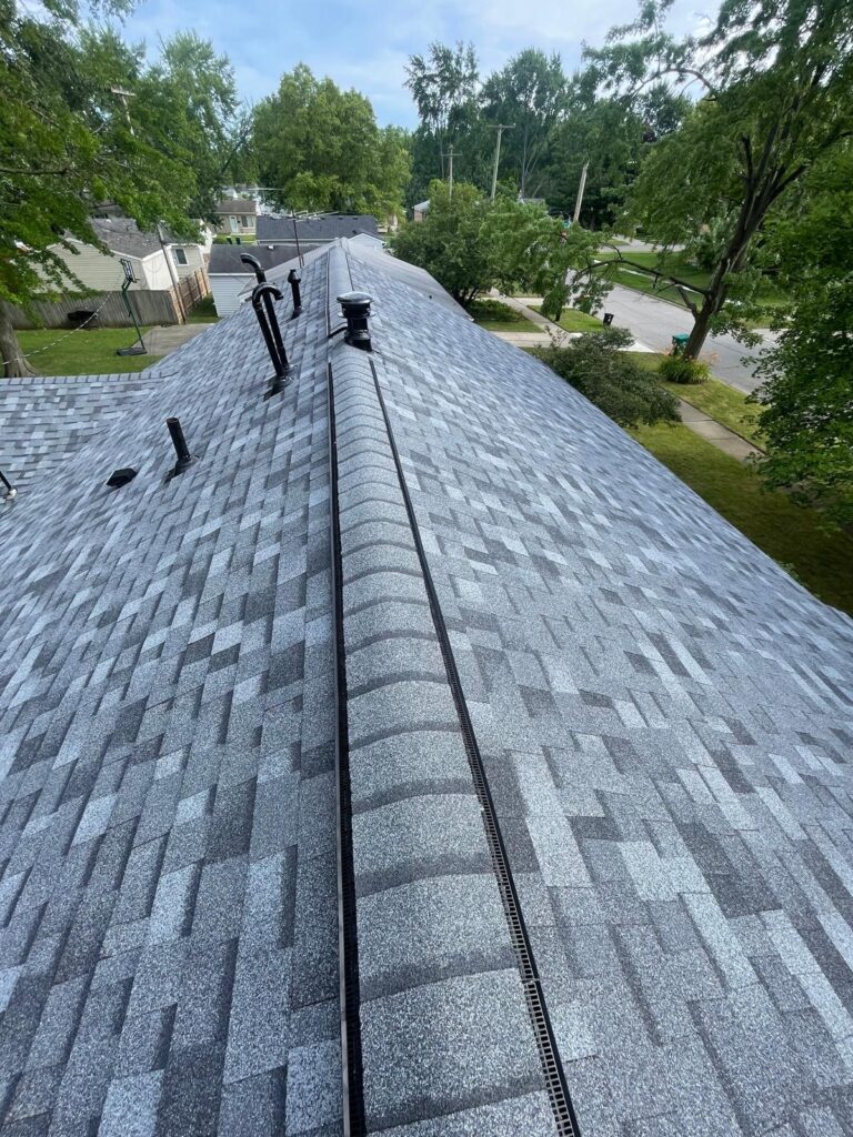 finished roof ridge with new shingles