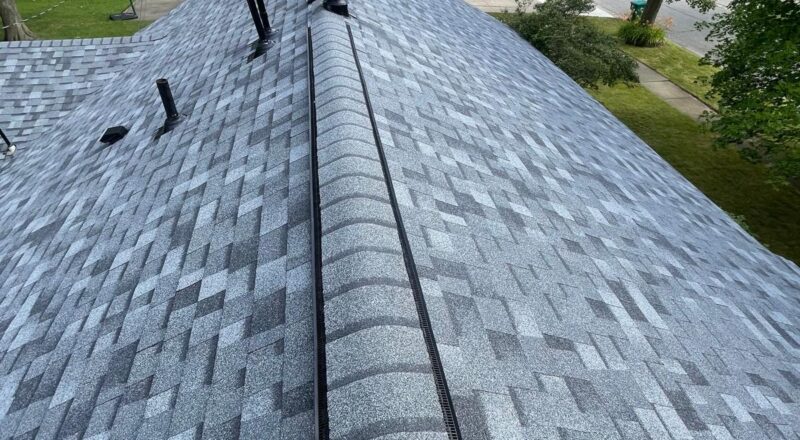 finished roof ridge with new shingles