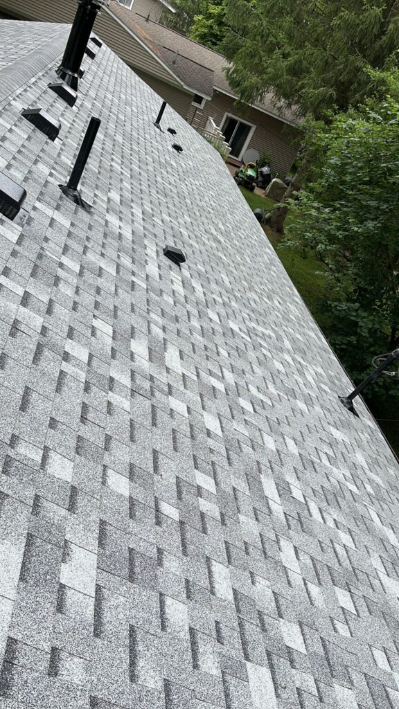 newly installed shingles and roof vents